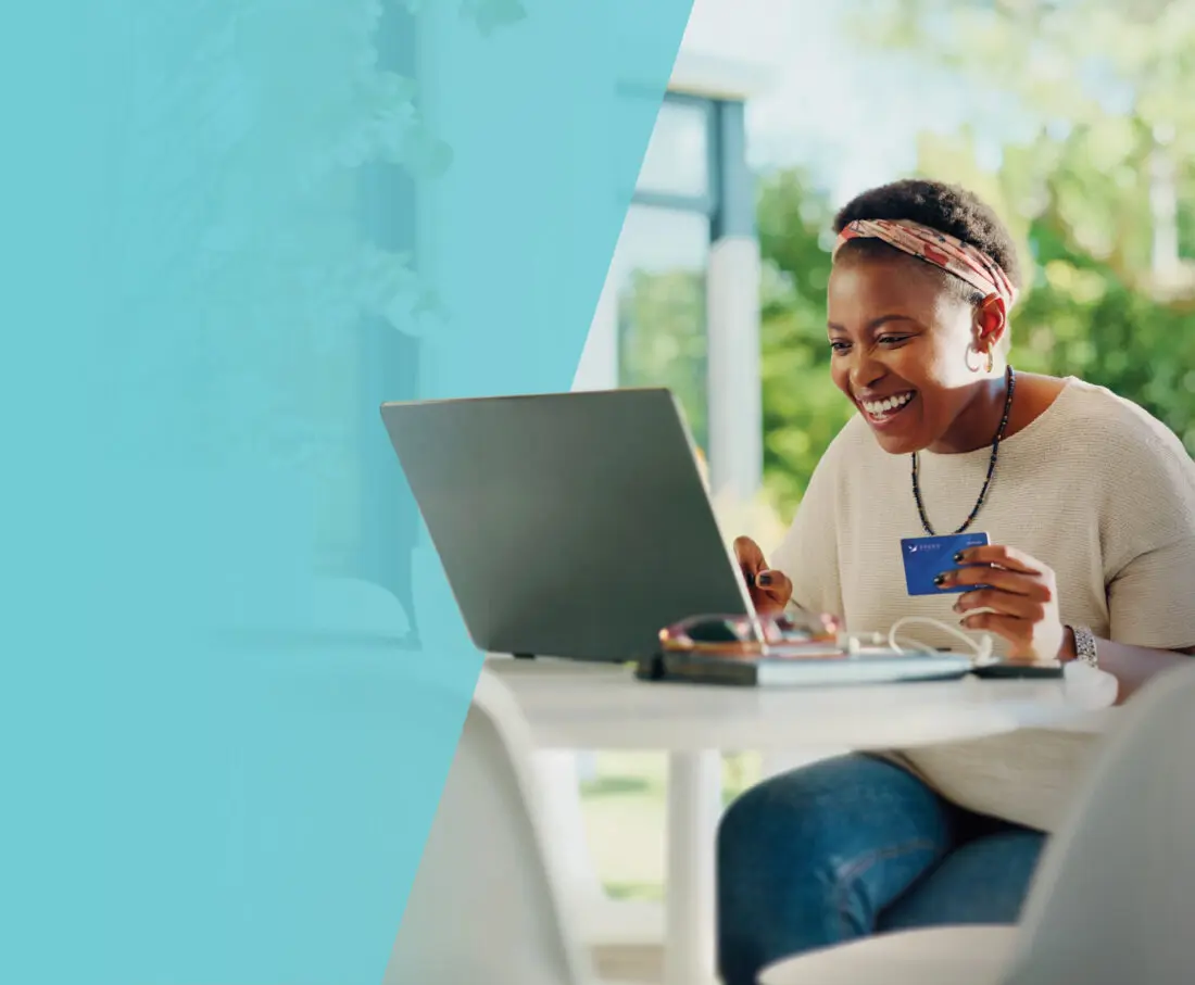 Lady on her computer with Spero debit card